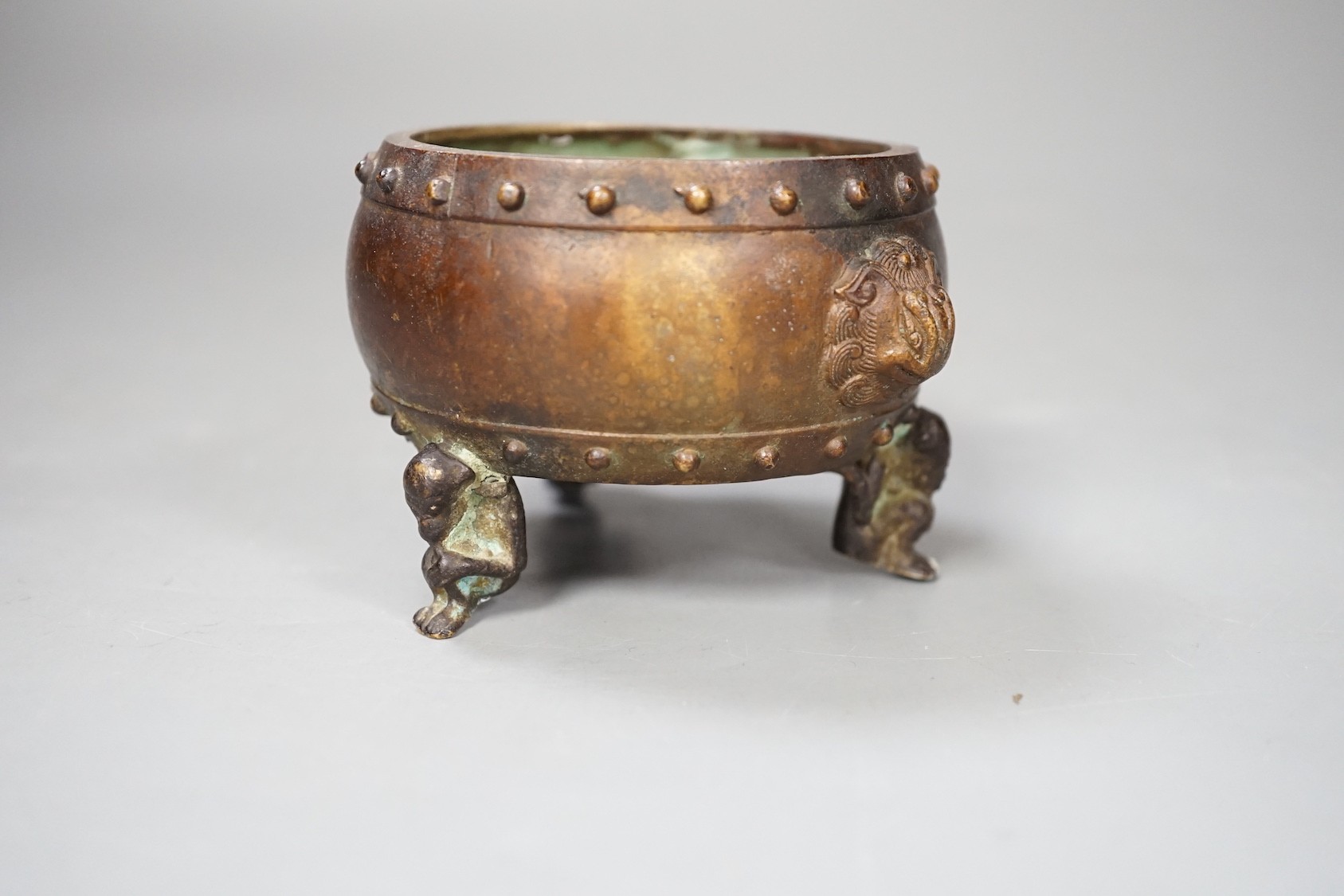 A Chinese bronze tripod censer, Xuande mark - 7cm tall